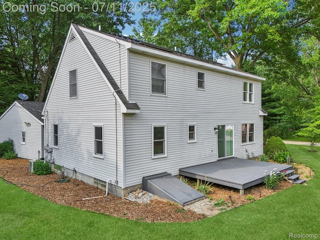 10746 Winthrop, Pinckney, MI 48169 - back of property with a yard and a wooden deck