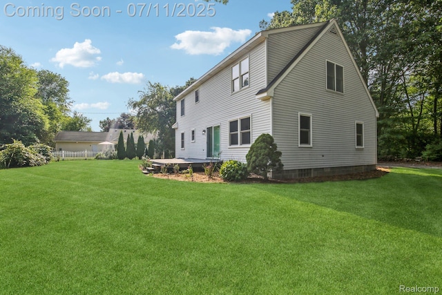 10746 Winthrop, Pinckney, MI 48169 - rear view of property featuring a lawn