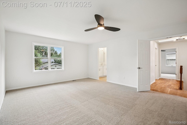 10746 Winthrop, Pinckney, MI 48169 - unfurnished bedroom featuring light colored carpet, ensuite bath, and ceiling fan