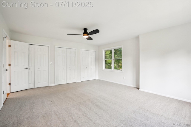10746 Winthrop, Pinckney, MI 48169 - unfurnished bedroom with carpet flooring, two closets, and ceiling fan