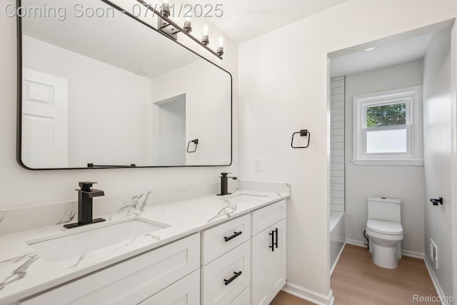 10746 Winthrop, Pinckney, MI 48169 - bathroom with double vanity, wood finished floors, and shower / tub combination