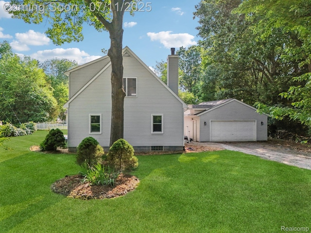 10746 Winthrop, Pinckney, MI 48169 - view of home's exterior featuring a chimney, a lawn, a detached garage, and an outdoor structure