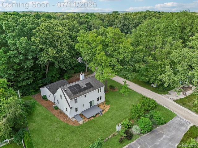 10746 Winthrop, Pinckney, MI 48169 - aerial view of property and surrounding area with a heavily wooded area