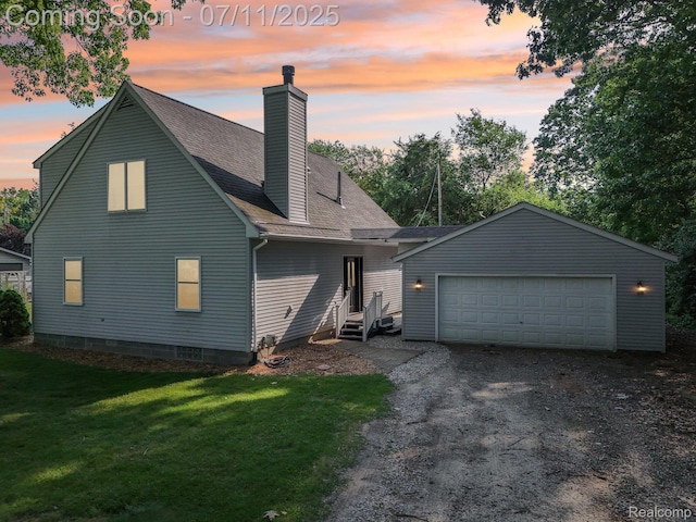 10746 Winthrop, Pinckney, MI 48169 - view of front of house featuring a chimney, a front yard, an attached garage, roof with shingles, and driveway