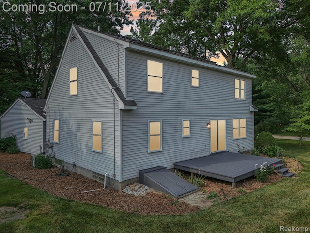 10746 Winthrop, Pinckney, MI 48169 - back of house with a deck and a yard