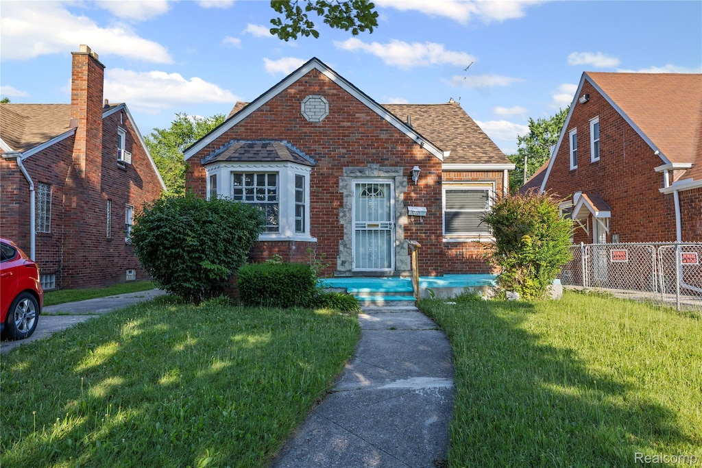 17221 Albion St, Detroit, MI 48234 - bungalow with brick siding and a shingled roof