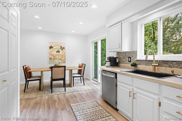 9157 Hackberry Ave, Plymouth, MI 48170 - kitchen featuring dishwasher, light wood-type flooring, white cabinetry, decorative backsplash, and recessed lighting