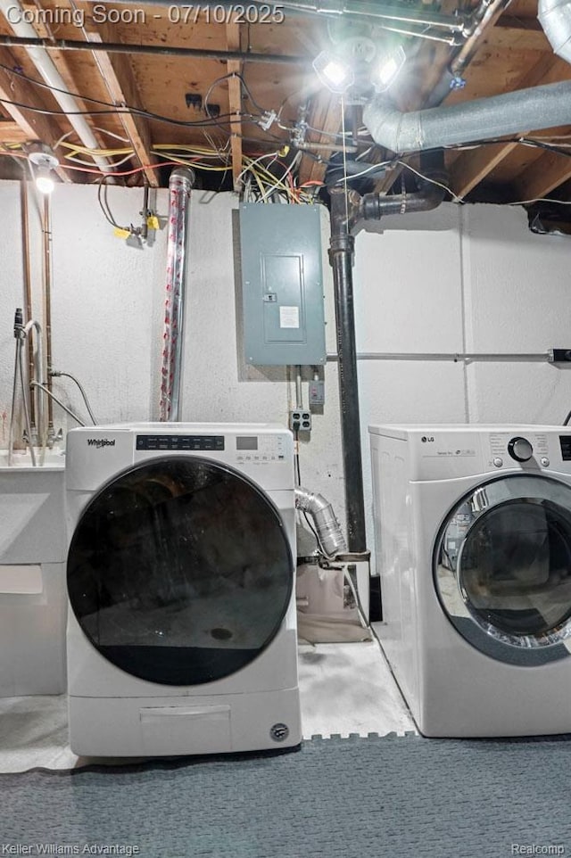 9157 Hackberry Ave, Plymouth, MI 48170 - laundry area with electric panel and washer and clothes dryer