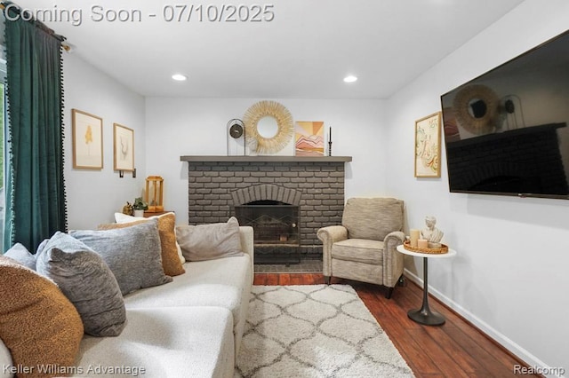 9157 Hackberry Ave, Plymouth, MI 48170 - living area with dark wood-style floors, a fireplace, and recessed lighting