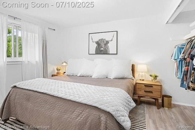 9157 Hackberry Ave, Plymouth, MI 48170 - bedroom with wood finished floors and baseboards