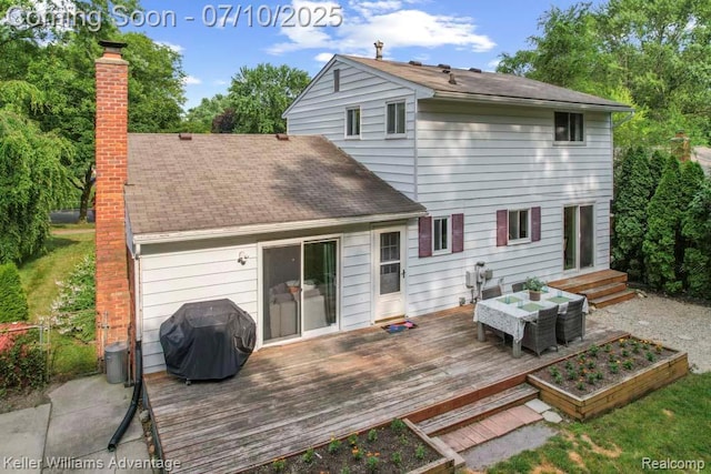 9157 Hackberry Ave, Plymouth, MI 48170 - rear view of house with a chimney, a wooden deck, and roof with shingles
