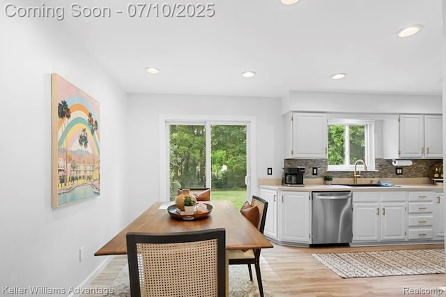 9157 Hackberry Ave, Plymouth, MI 48170 - kitchen with dishwasher, light wood-type flooring, decorative backsplash, light countertops, and recessed lighting