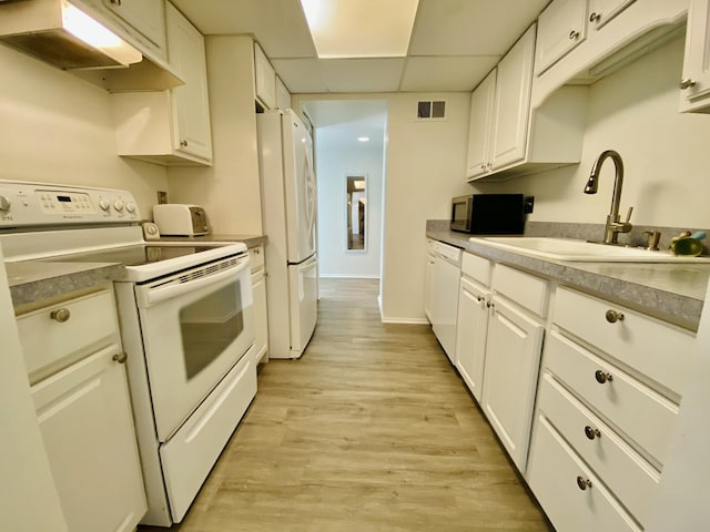 18220 University Park Dr, Livonia, MI 48152 - kitchen featuring white appliances, under cabinet range hood, white cabinets, light wood-style floors, and a paneled ceiling