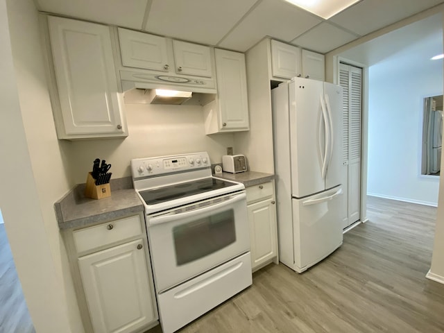 18220 University Park Dr, Livonia, MI 48152 - kitchen featuring white appliances, under cabinet range hood, white cabinetry, light wood-style flooring, and a drop ceiling