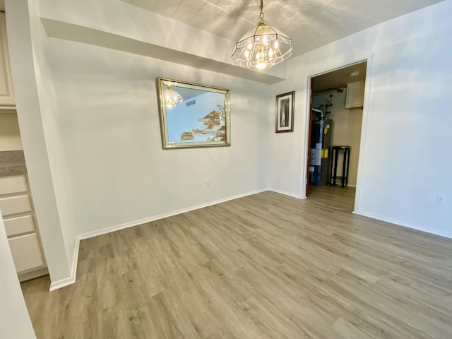 18220 University Park Dr, Livonia, MI 48152 - unfurnished dining area with a chandelier, water heater, and light wood-style floors