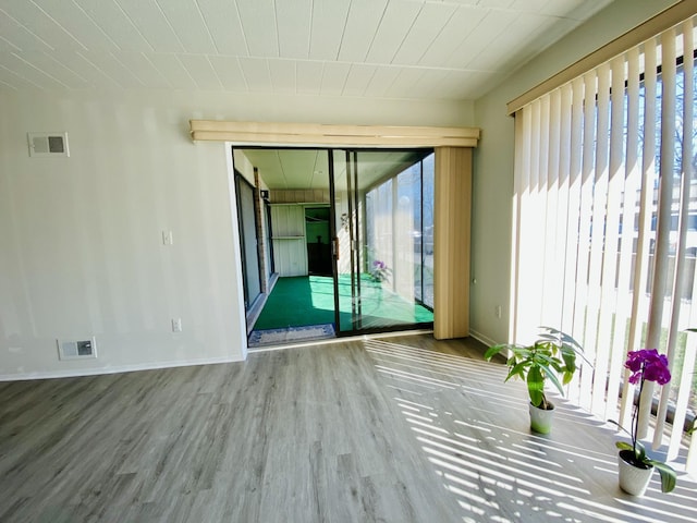 18220 University Park Dr, Livonia, MI 48152 - unfurnished room with wood finished floors and wooden ceiling