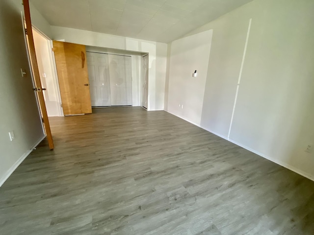 18220 University Park Dr, Livonia, MI 48152 - unfurnished bedroom with wood finished floors and a closet