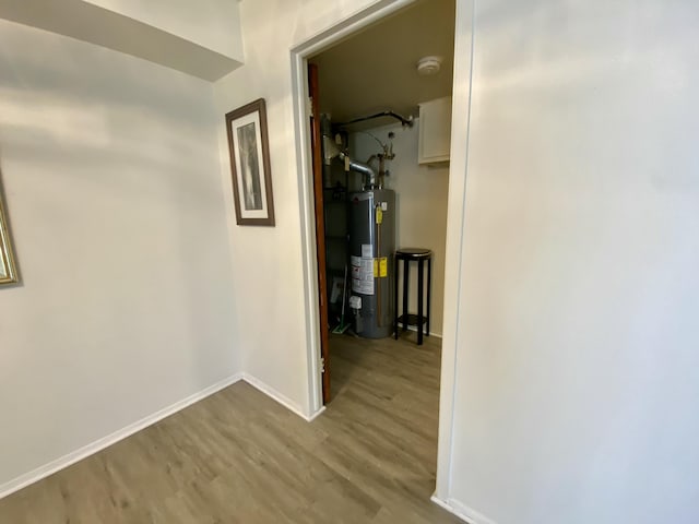 18220 University Park Dr, Livonia, MI 48152 - hallway featuring gas water heater and wood finished floors