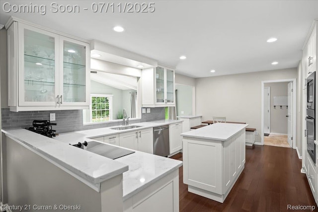 42369 Crestview Cir, Northville, MI 48168 - kitchen featuring a kitchen island, dishwasher, backsplash, white cabinetry, and recessed lighting