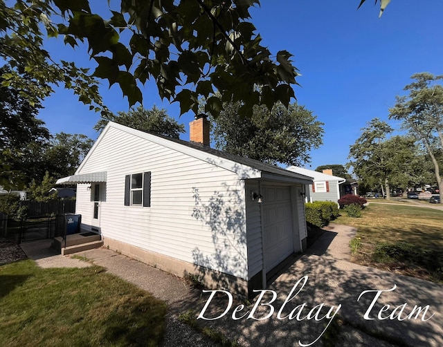 1056 Sherwood Rd, Muskegon, MI 49441 - view of side of home with a chimney