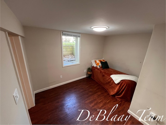 1056 Sherwood Rd, Muskegon, MI 49441 - bedroom featuring wood finished floors and baseboards