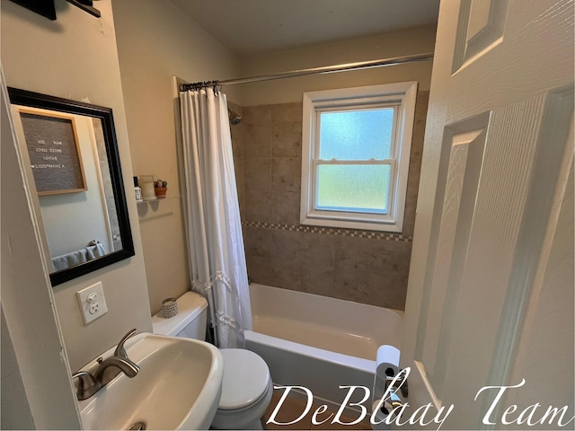 1056 Sherwood Rd, Muskegon, MI 49441 - bathroom featuring a sink and shower / bath combo with shower curtain
