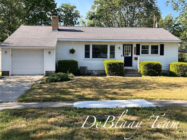 1056 Sherwood Rd, Muskegon, MI 49441 - single story home with a chimney, a front yard, driveway, an attached garage, and entry steps