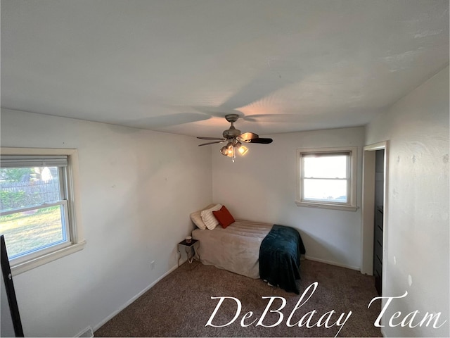 1056 Sherwood Rd, Muskegon, MI 49441 - carpeted bedroom featuring a ceiling fan and baseboards