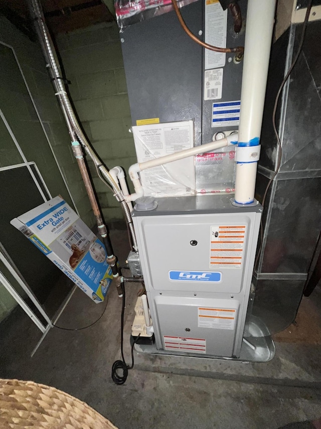 1056 Sherwood Rd, Muskegon, MI 49441 - utility room featuring heating unit