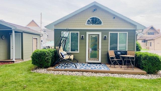 4111 E Joy Rd, Shelbyville, MI 49344 - back of house featuring a lawn and a wooden deck