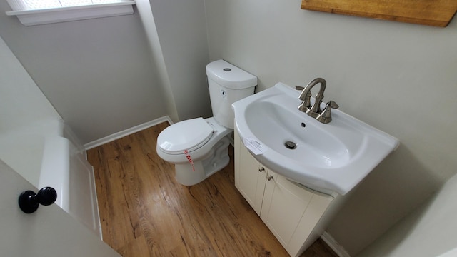2031 Baker St, Muskegon, MI 49444 - bathroom with wood finished floors and vanity