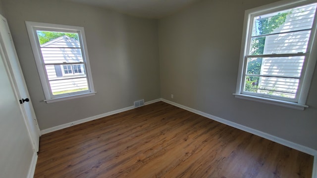 2031 Baker St, Muskegon, MI 49444 - spare room with wood finished floors