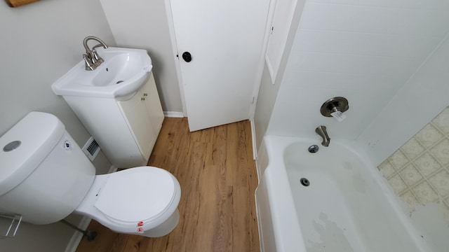 2031 Baker St, Muskegon, MI 49444 - full bathroom featuring wood finished floors and  shower combination
