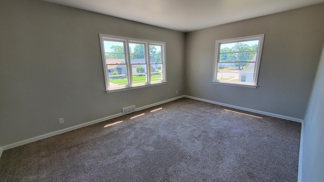 2031 Baker St, Muskegon, MI 49444 - unfurnished room with dark colored carpet and baseboards
