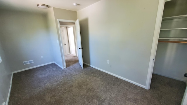 2031 Baker St, Muskegon, MI 49444 - unfurnished bedroom featuring carpet flooring and a closet