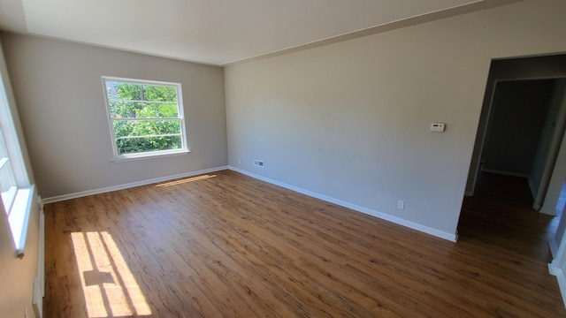 2031 Baker St, Muskegon, MI 49444 - unfurnished room featuring wood finished floors and baseboards