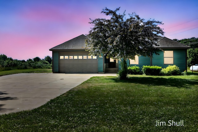 8201 Crocker Rd, Holton, MI 49425 - view of front facade with a garage, a yard, and driveway