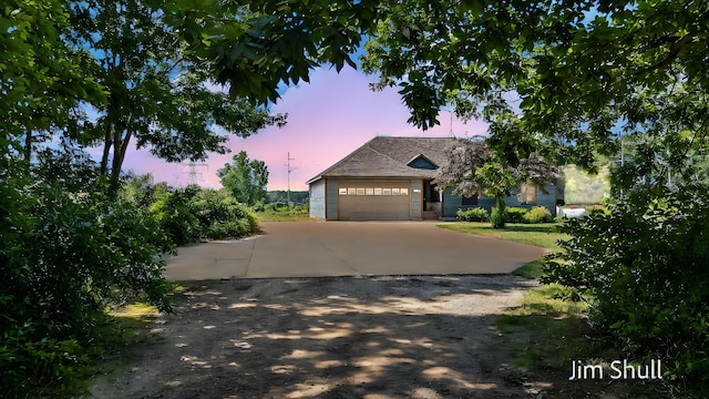 8201 Crocker Rd, Holton, MI 49425 - view of front facade with driveway and an attached garage