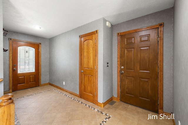 8201 Crocker Rd, Holton, MI 49425 - entryway featuring light tile patterned floors