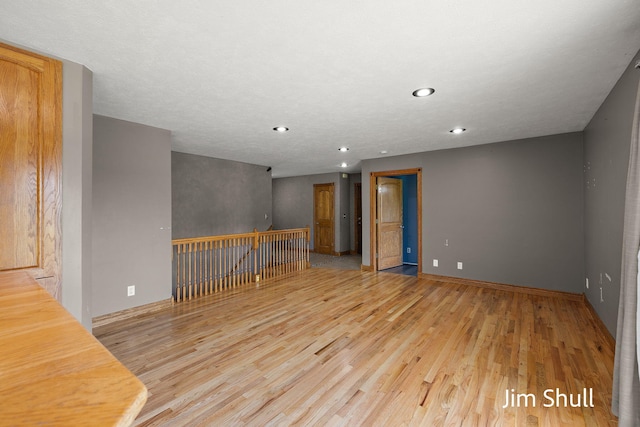 8201 Crocker Rd, Holton, MI 49425 - empty room featuring light wood-type flooring and recessed lighting