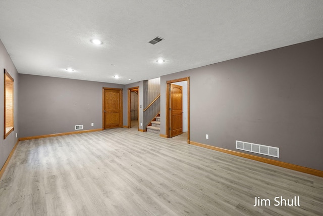8201 Crocker Rd, Holton, MI 49425 - empty room with stairway, light wood finished floors, and recessed lighting