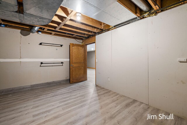 8201 Crocker Rd, Holton, MI 49425 - unfinished below grade area featuring light wood-style floors