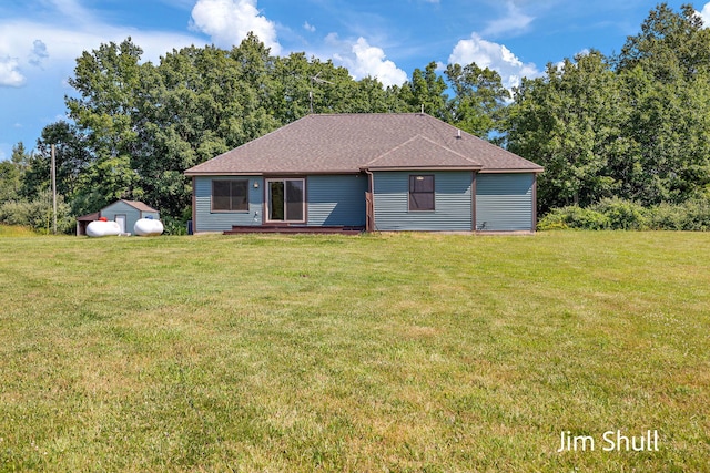8201 Crocker Rd, Holton, MI 49425 - view of front of property with a front lawn and a shingled roof