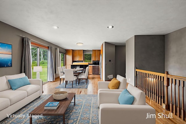 8201 Crocker Rd, Holton, MI 49425 - living room with light wood-style flooring and recessed lighting