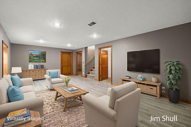 8201 Crocker Rd, Holton, MI 49425 - living area with light wood finished floors, stairs, and recessed lighting