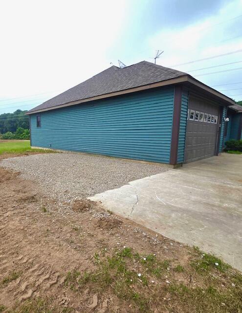 8201 Crocker Rd, Holton, MI 49425 - view of side of property with roof with shingles