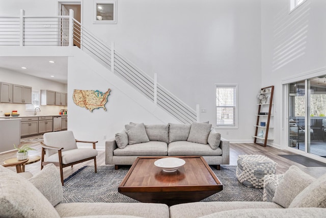 32 Walden Way, New Buffalo, MI 49117 - living area featuring a towering ceiling, light wood-style floors, stairs, and recessed lighting