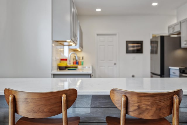 32 Walden Way, New Buffalo, MI 49117 - kitchen with freestanding refrigerator, recessed lighting, and gray cabinets
