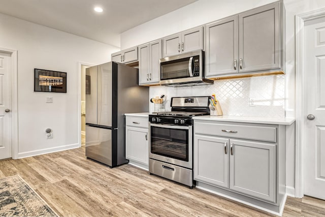 32 Walden Way, New Buffalo, MI 49117 - kitchen with stainless steel appliances, gray cabinets, light countertops, and recessed lighting