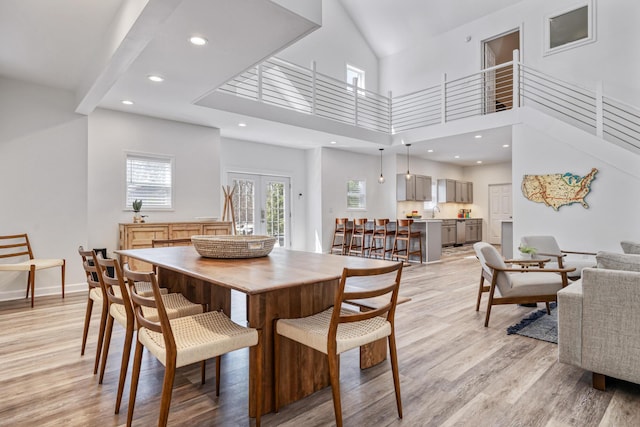 32 Walden Way, New Buffalo, MI 49117 - dining room featuring light wood-style flooring, french doors, a high ceiling, and recessed lighting